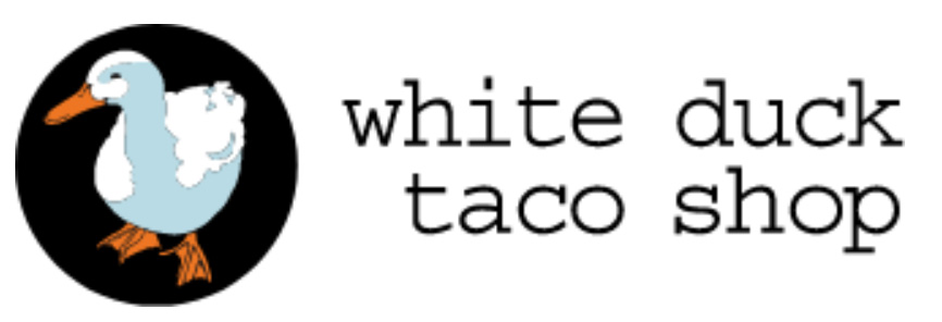 White Duck Taco Shop patio near the river with colorful seating